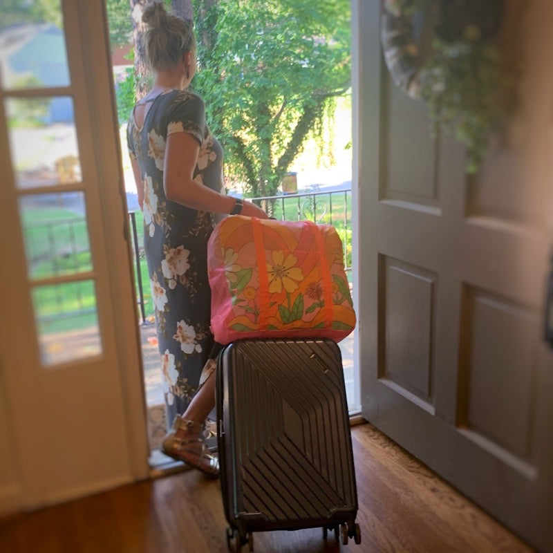 Floral travel carry on shoulder bag on model