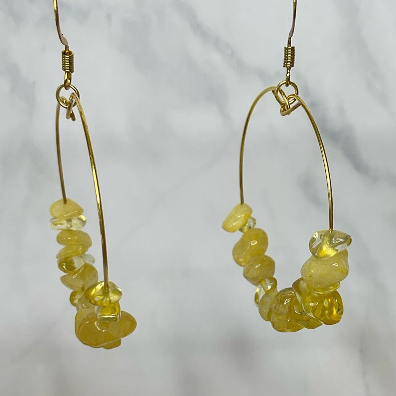 Yellow beaded hoop earrings close up