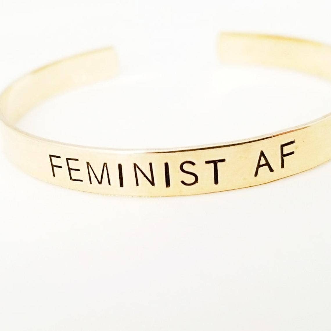 slide on gold bangle bracelet that says feminist af feminism fierce feminist as fuck jewelry bracelet women