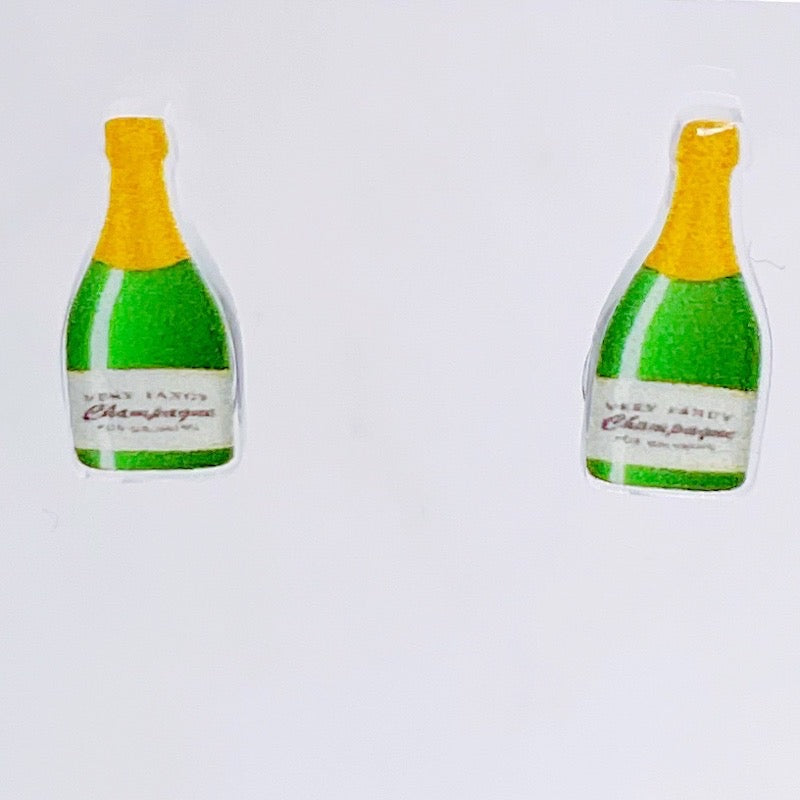 Champagne bottle stud earrings close up