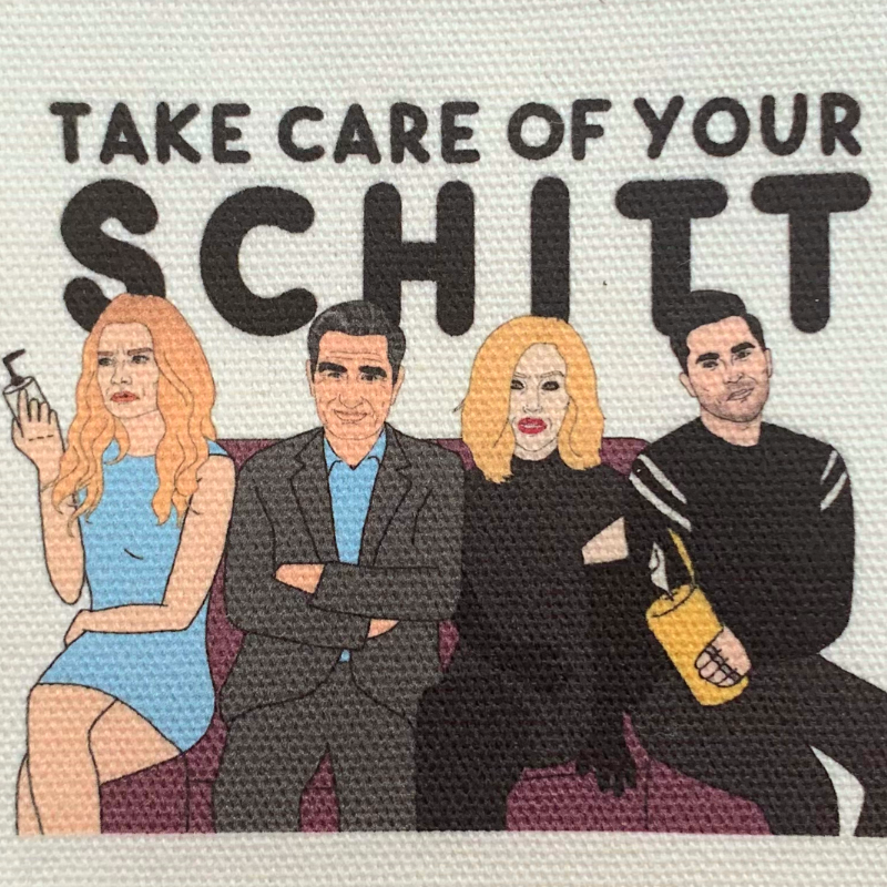 Schitt's Creek Take Care of Your Schitt small square zipper and key chain pouch close up of artwork
