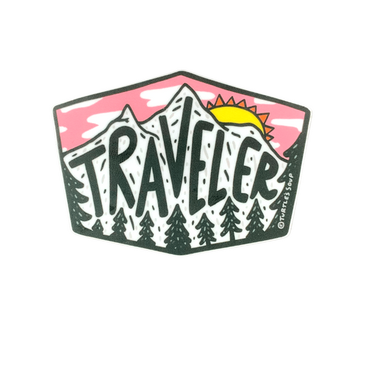 premium quality indoor outdoor vinyl sticker decal that says traveler on top of an image of mountains with pine trees at the bottom and a pink sunset above