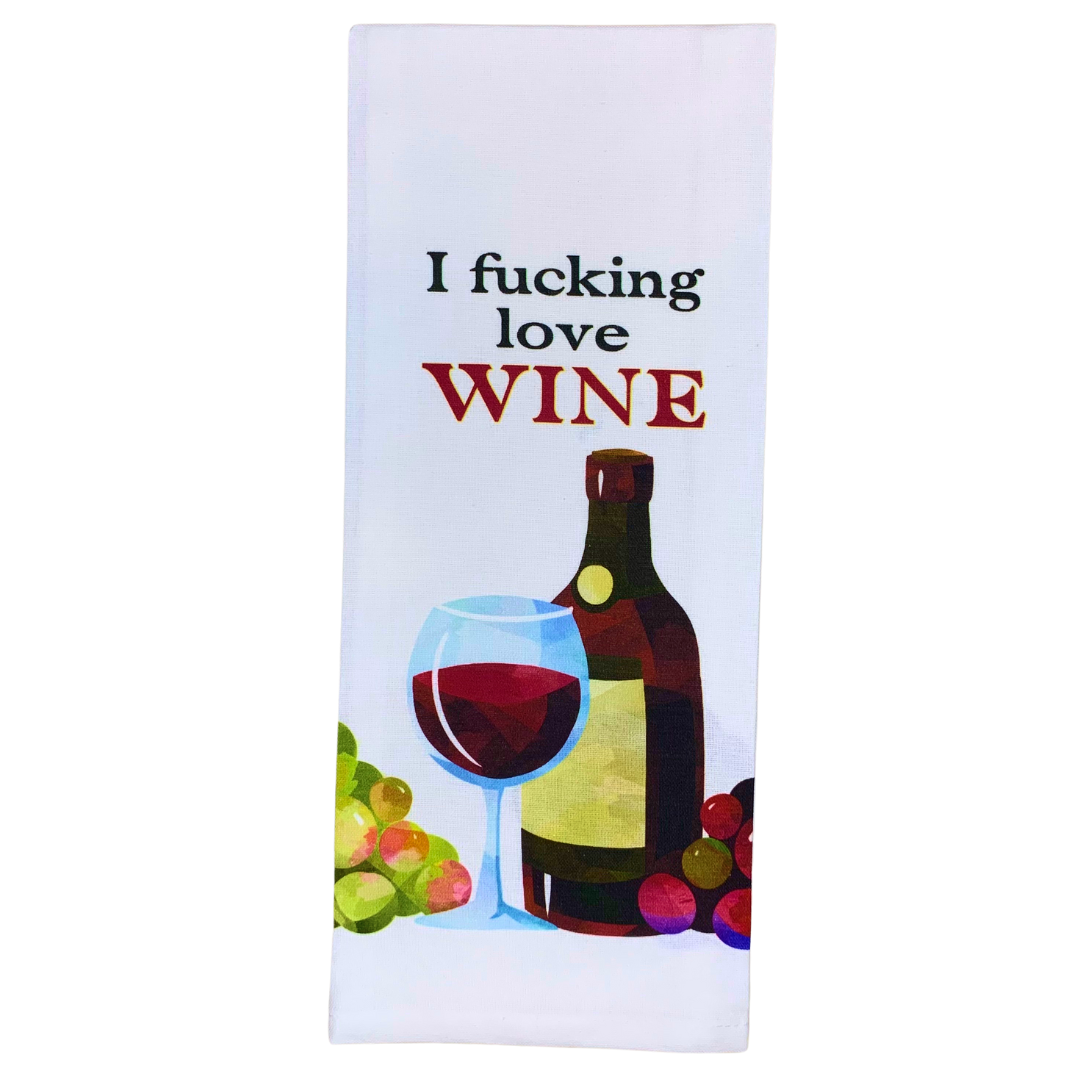 premium quality pre-shrunk hand kitchen towel that is white and says I fucking love wine with an image of a red wine bottle glass of red wine and green and red grapes at the bottom