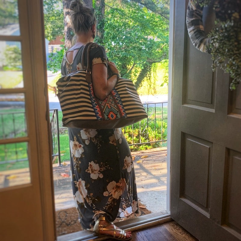 striped aztec weekender bag on model